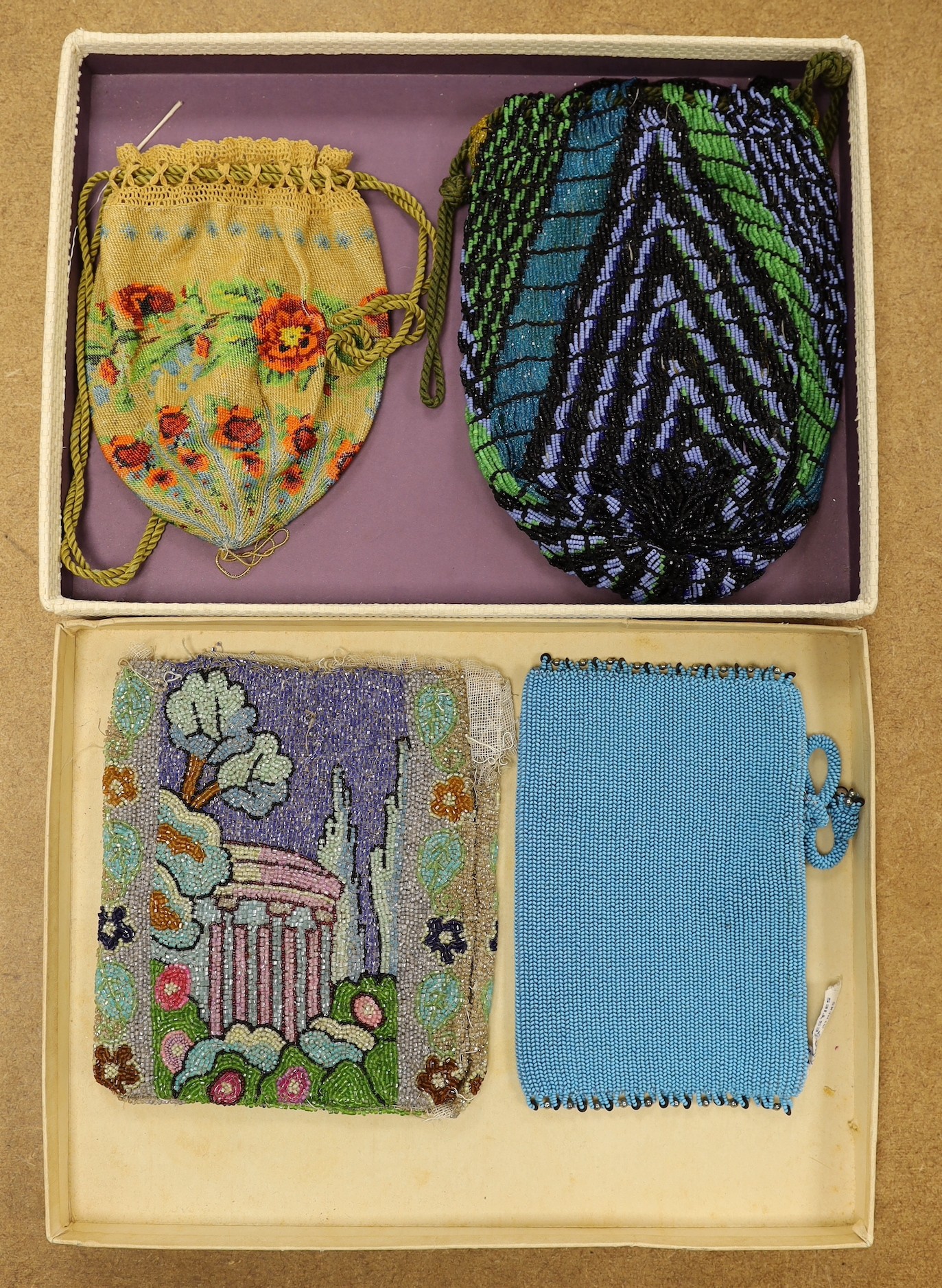 A late 19th century floral bead worked drawstring bag, a later jazz age beaded bag, a turquoise plain bead bag with zip and an unlined bead bag with a classical scene, (4)